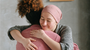 two women embracing each other